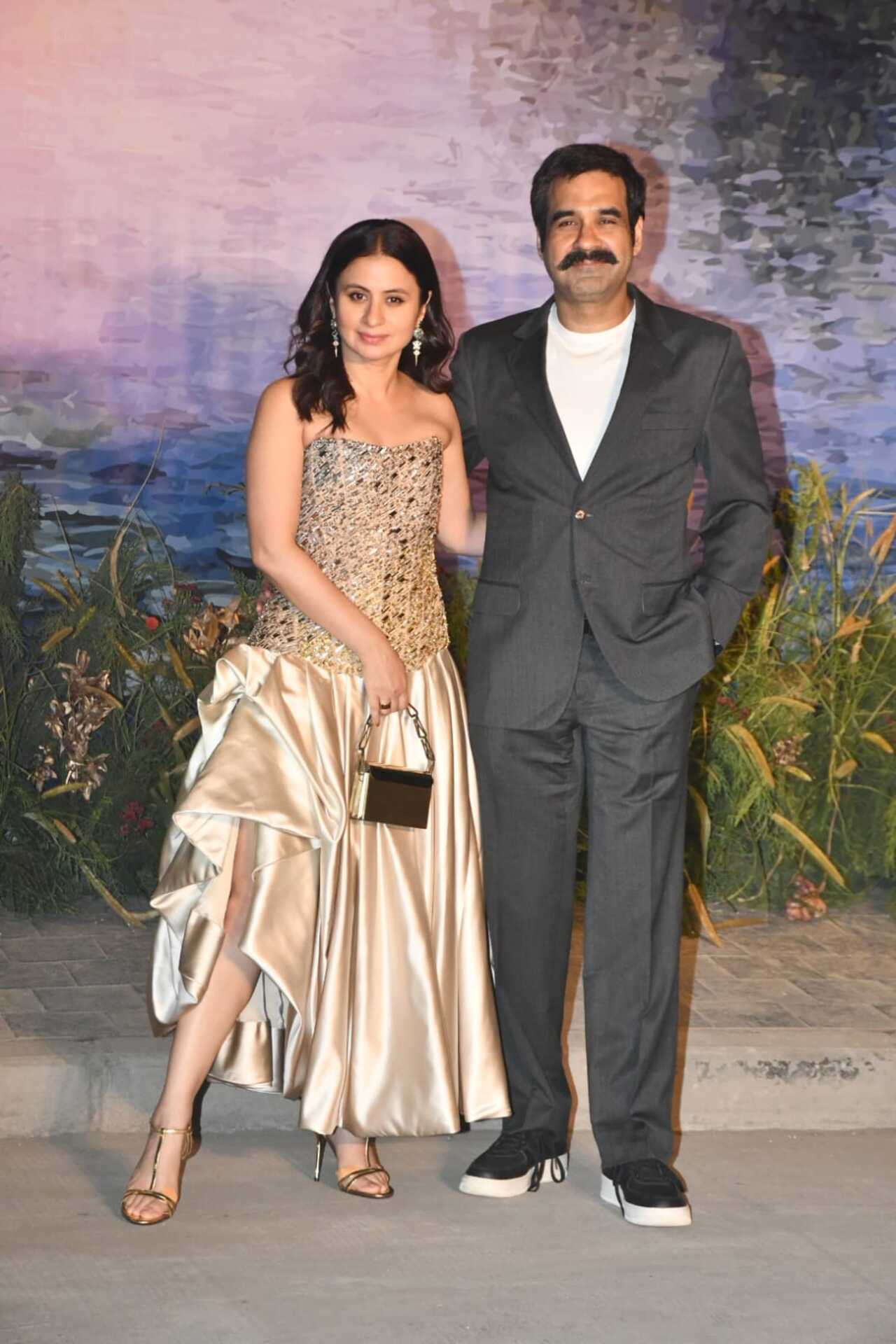 Rasika Dugal was spotted with her husband Mukul Chadda at the event. Rasika looked elegant in a gold satin gown featuring mirror work from the bodice to the waist.